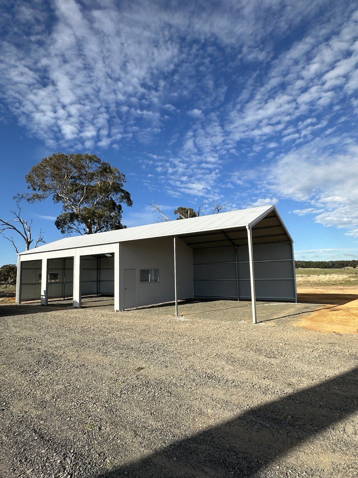 Shed with open covered bay